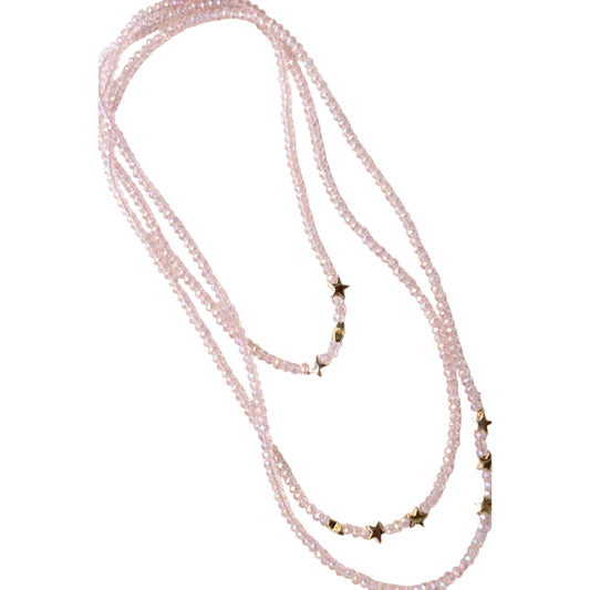 Long beaded necklace with star-shaped beads on a white background