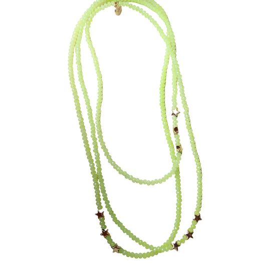 Green beaded necklace with star-shaped beads on a white background