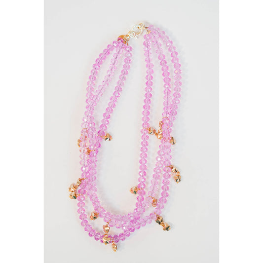 three-strand necklace with lavender crystal beads and multiple gold butterfly beads with a gold pave clasp