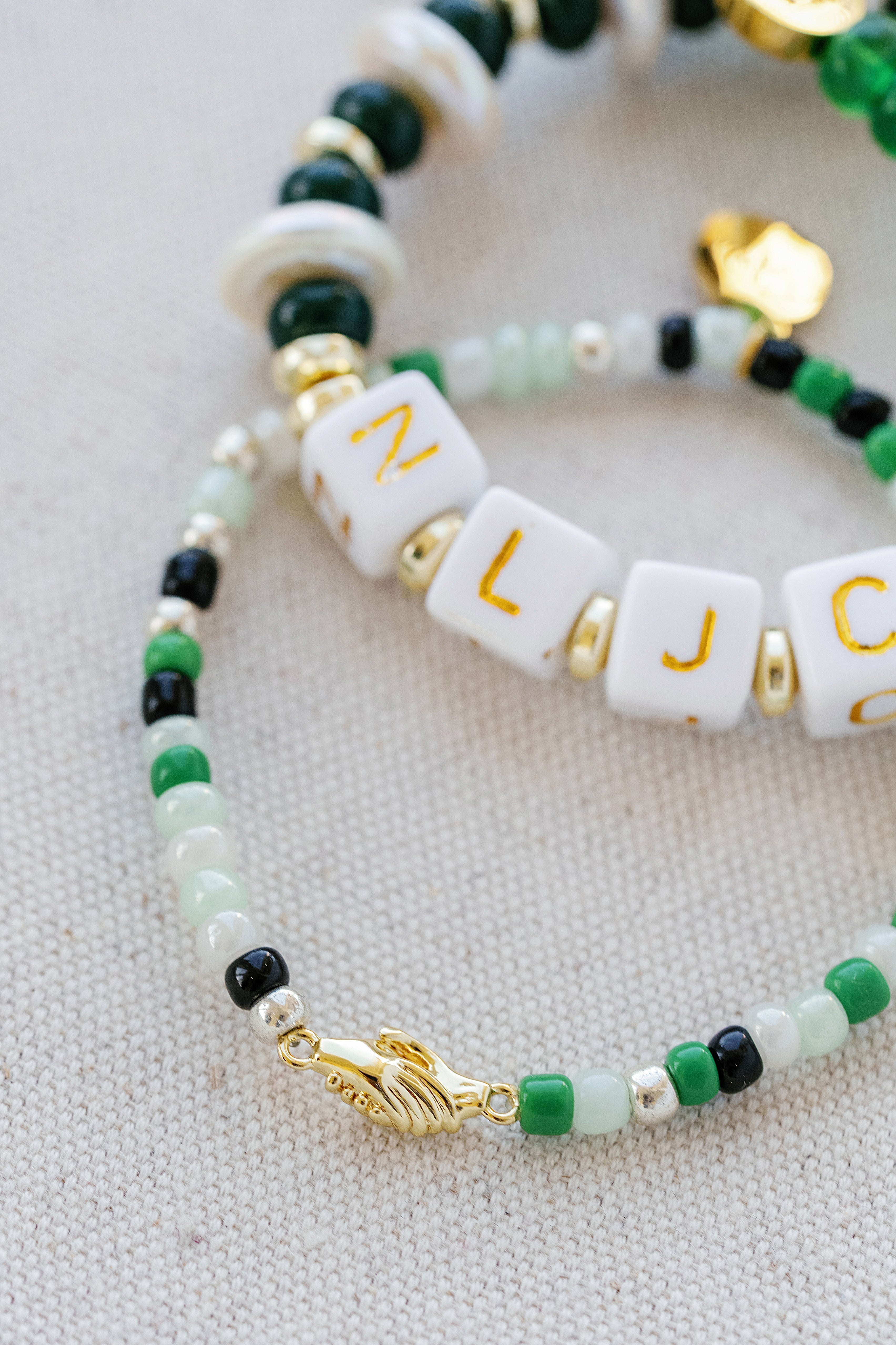 A pair of beaded bracelets from the Taylor Reese x National League of Junior Cotillion collection