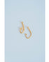 two gold fishing hook charms on a light grey background