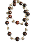 Necklace with wooden beads and gold accents on a white background