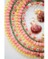 Colorful beaded necklaces and shell earrings on a white background