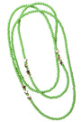 Green beaded necklace with star-shaped charms on a white background