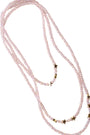 Long beaded necklace with star-shaped beads on a white background