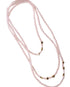 Long beaded necklace with star-shaped beads on a white background