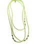 Green beaded necklace with star-shaped beads on a white background