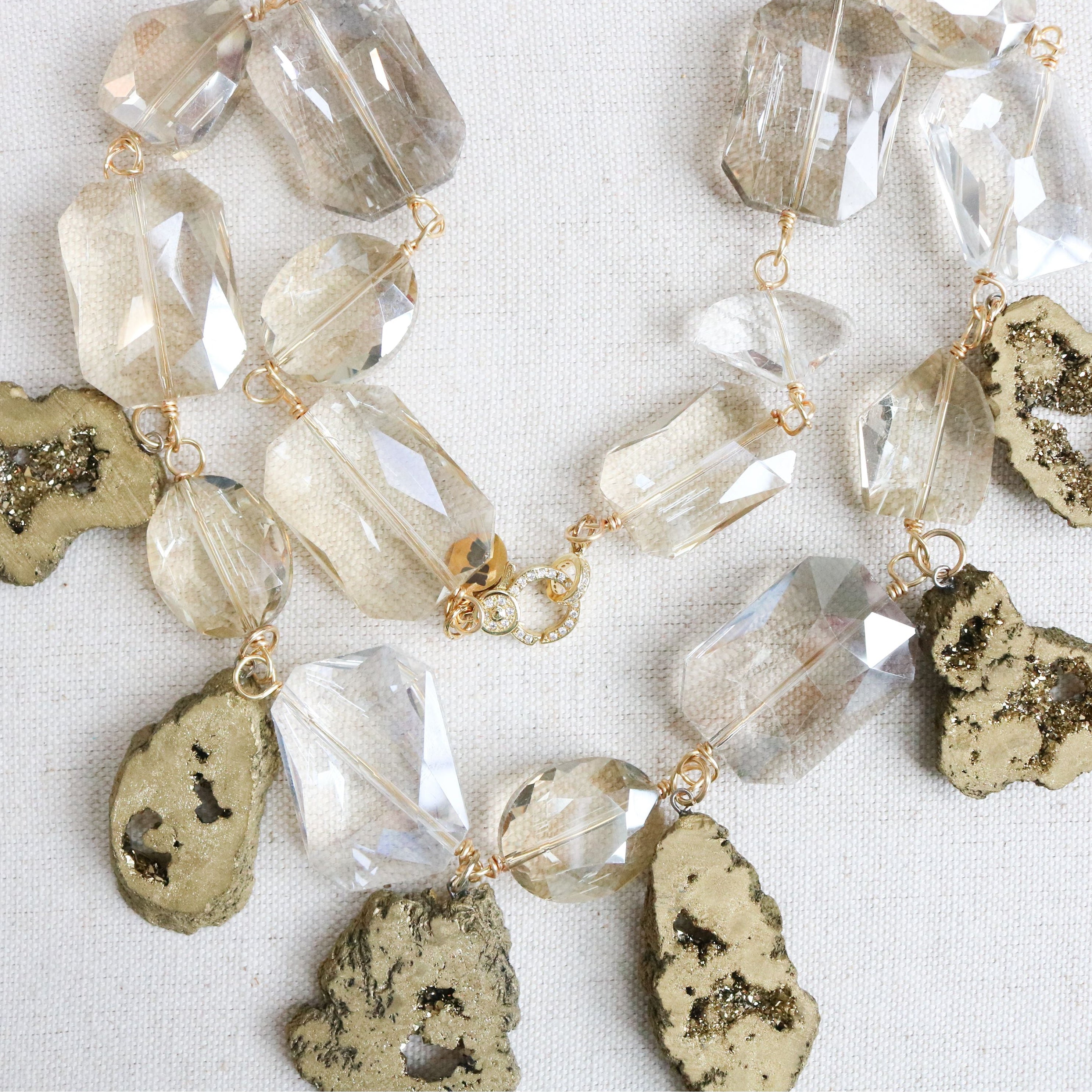 Necklace with crystal and stone beads on a white background