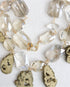 Necklace with crystal and stone beads on a white background