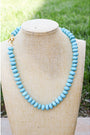 Turquoise howlite hand knotted necklace with pave gold lever clasp