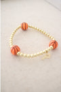 stretch bracelet with three basketball beads and gold hematite ball beads