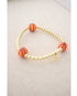 stretch bracelet with three basketball beads and gold hematite ball beads