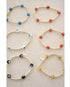 the evil eye goldie bracelet shown in blue, orange,white, red, yellow, and black color options