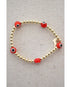 red and black evil eye beads on a gold hematite stretch bracelet