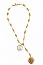 gold chain necklace with mother of pearl pendant and brass locket pendant on a white background