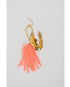 Gold shrimp earrings with pink beaded tassels on a light gray background