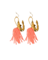 Pair of earrings with brass gold shrimp pendant and pink beaded tassels on a white background