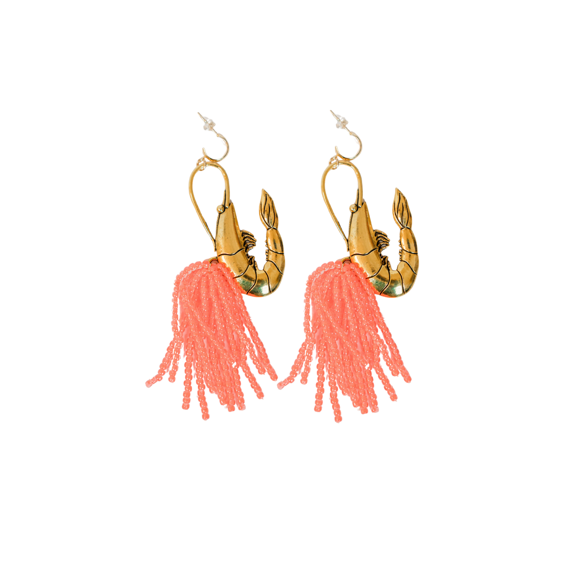 Pair of earrings with brass gold shrimp pendant and pink beaded tassels on a white background