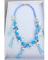 Tar Heel blue beaded tassels topped with ceramic ram mascot beads on a beaded blue necklace.