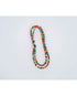layered necklaces with multicolored glass beads on a light background