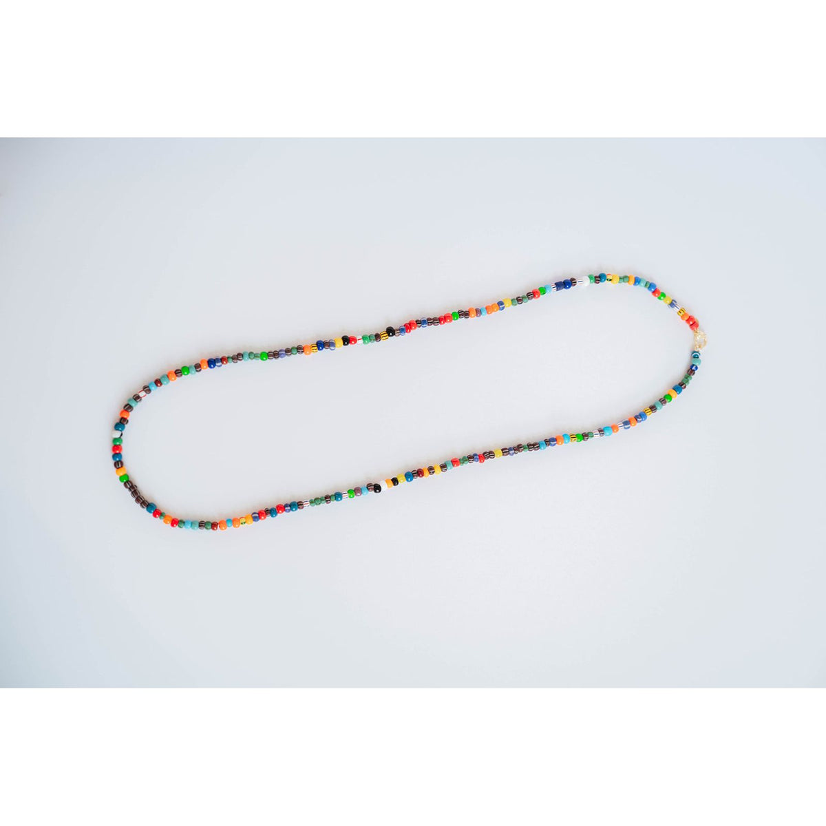 multicolor beaded necklace on a light background
