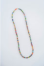 multicolor beaded necklace on a light grey background