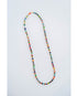 multicolor beaded necklace on a light grey background
