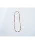 multicolor beaded necklace on a light grey background