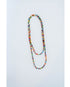 layered multicolor beaded necklace on a light grey background