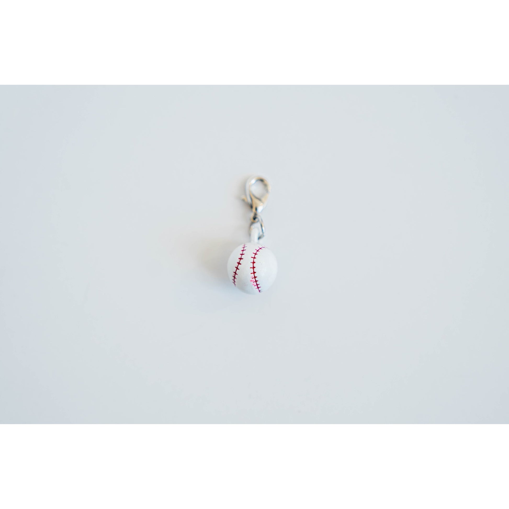 Baseball charm on a white background