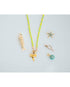 neon cord necklace with collection of gold starfish, fish, and shark tooth charms on a light grey background