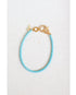 light blue box chain bracelet with a gold pave lever clasp on a light grey background