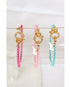 set of 3 colorful chain bracelets in hot pink, light pink, and teal blue with gold pave lever clasps on a clear bracelet holder