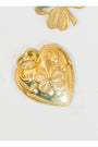 Vintage Gold heart-shaped pendant with clover design on a white background