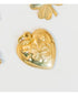 Vintage Gold heart-shaped pendant with clover design on a white background