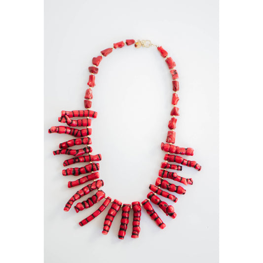 Red and black coral shaped beads collar necklace on a white background