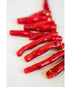 red coral beaded necklace on a light grey background