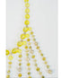 beaded necklace with yellow toned crystal bead accents on a light grey background
