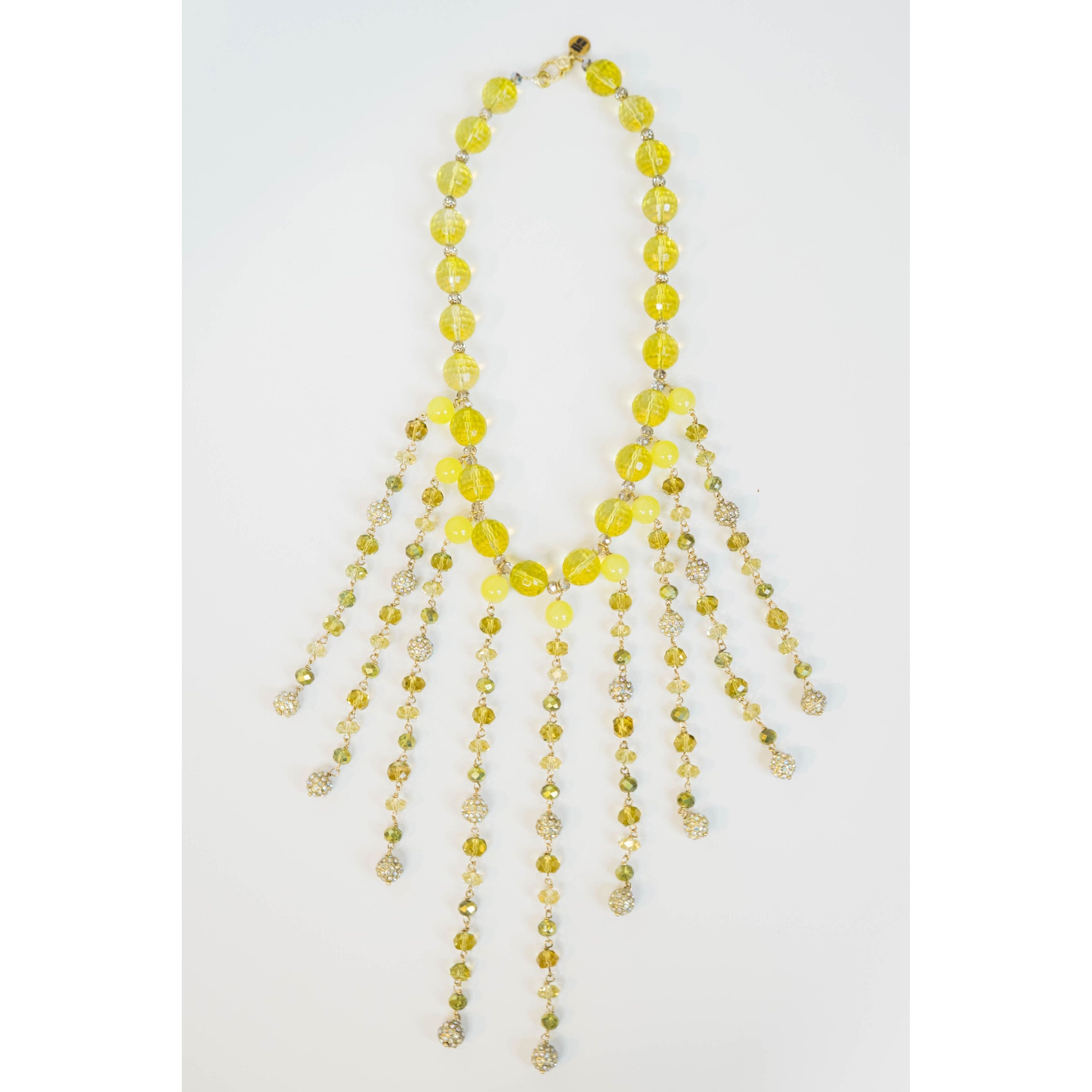 beaded necklace with yellow toned crystal bead accents on a light grey background