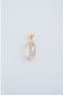 oval shaped gold pendant with a clear stone on a light gray background