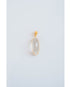 oval shaped gold pendant with a clear stone on a light gray background