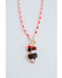 red and white color block cord necklace with a gold pave charm and an eagle pendant with black and red bead accents