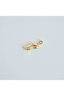 Gold shoe-shaped charm with pave detailing on a light gray background