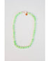 round light green beaded necklace with a gold pave lever clasp against a light background