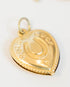 Double-sided gold/brass puffy heart charm with a horseshoe that reads "good luck"