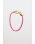 hot pink box chain bracelet with a gold pave lever clasp on a light grey background