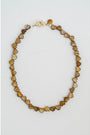 Necklace with heart-shaped beads on a light gray background