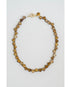 Necklace with heart-shaped beads on a light gray background