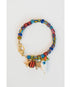 colorful beaded bracelet with charms of starfish and fish charm with a gold pave lever clasp on a light grey background