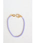 lavender box chain bracelet with a gold pave lever clasp on a light grey background